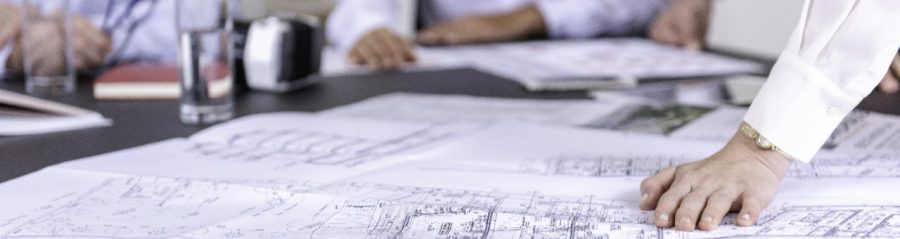 Blueprints at conference table